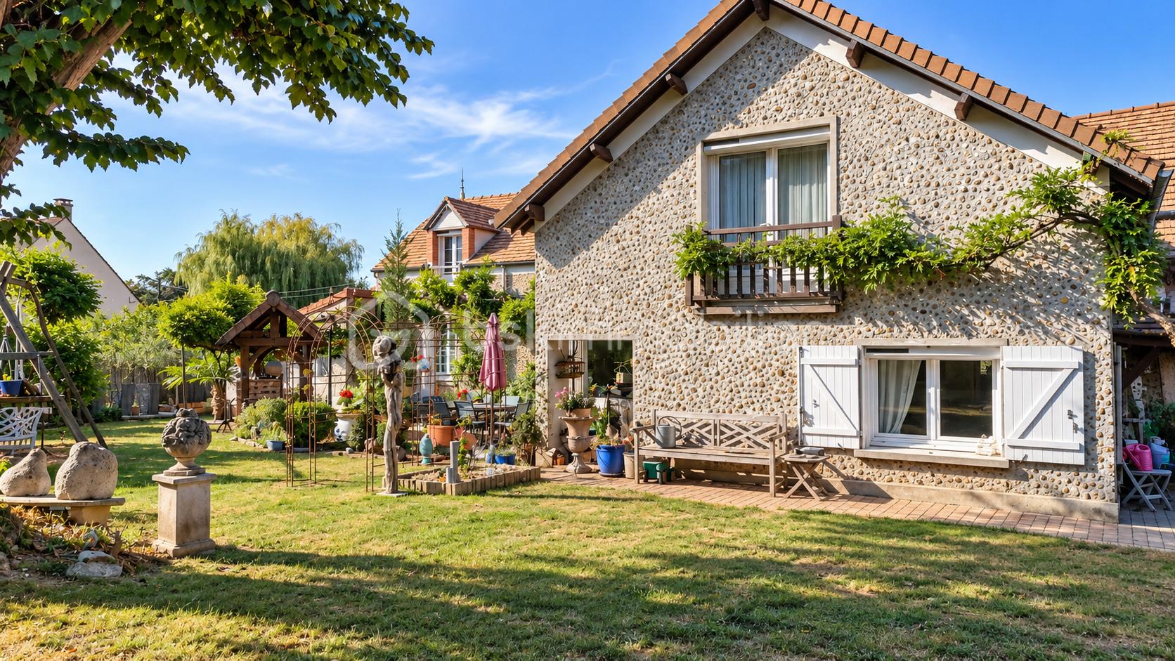 Maison en pierre et jardin fleuri ensoleillé.png