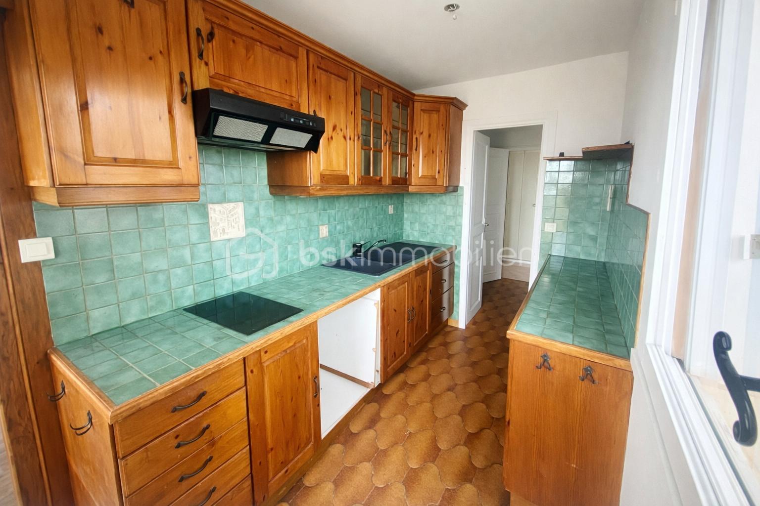 Appartement de 80,89 m² - Cuisine chaleureuse et accueillante.png