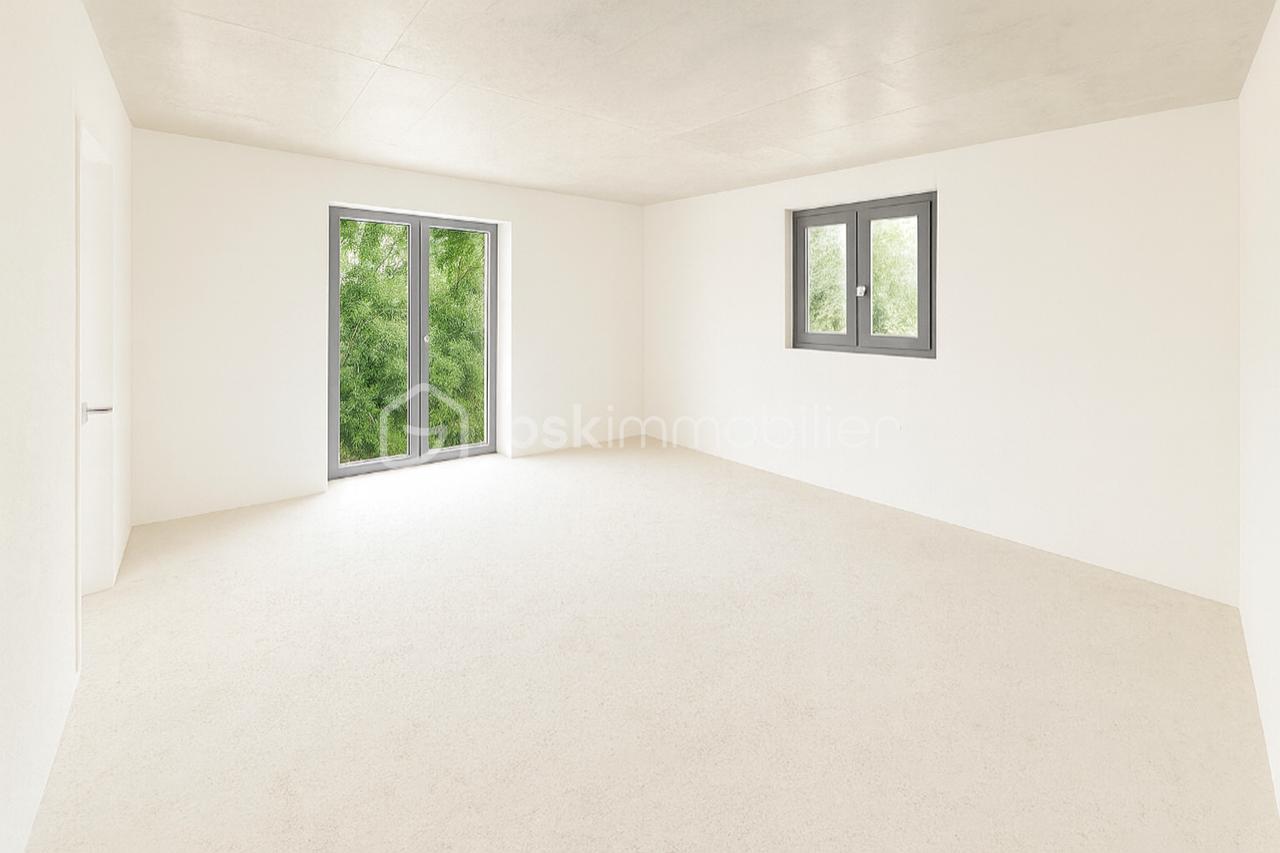 Appartement de 70,71 m² - thumbnail_Pièce à vivre vide blanche.png