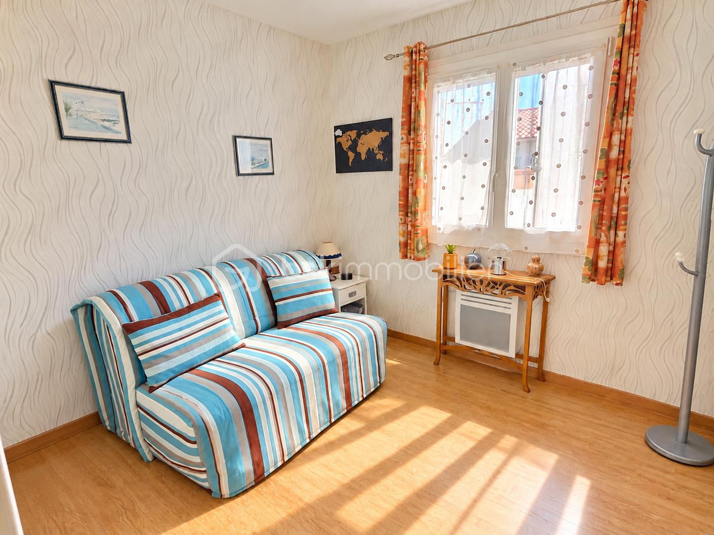 Sunlit Cozy Room with Striped Sofa.png
