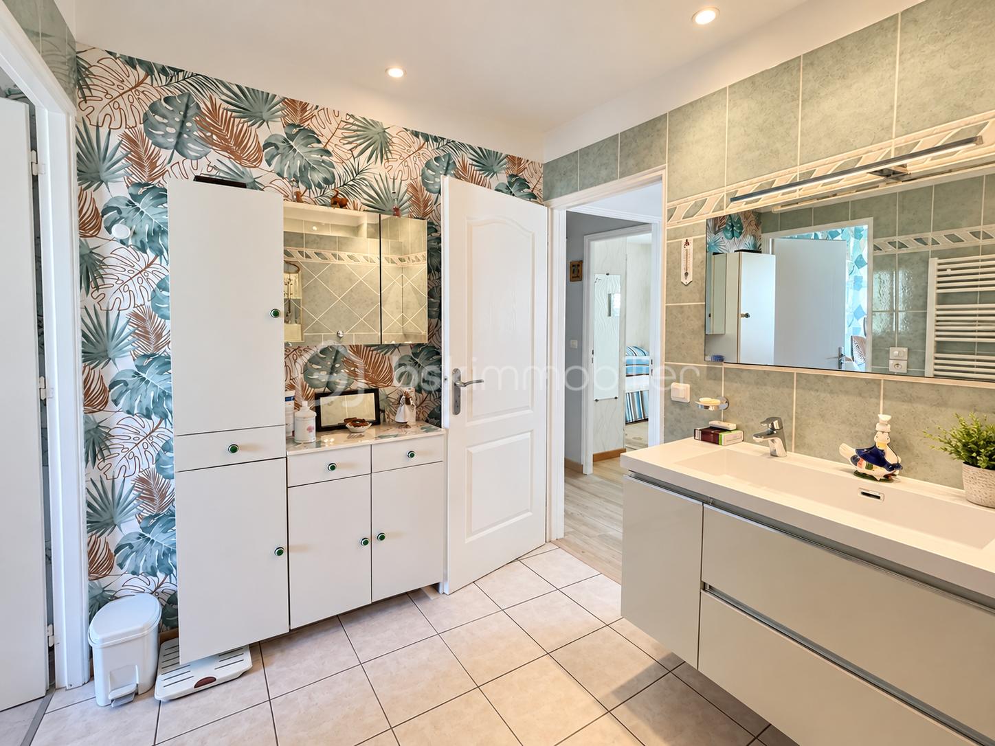 Modern Bathroom with Tropical Accent Wall.png