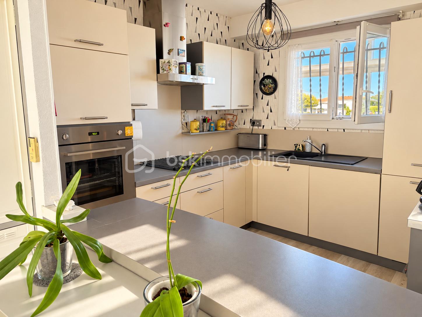 Sunlit Contemporary U-Shaped Kitchen.png