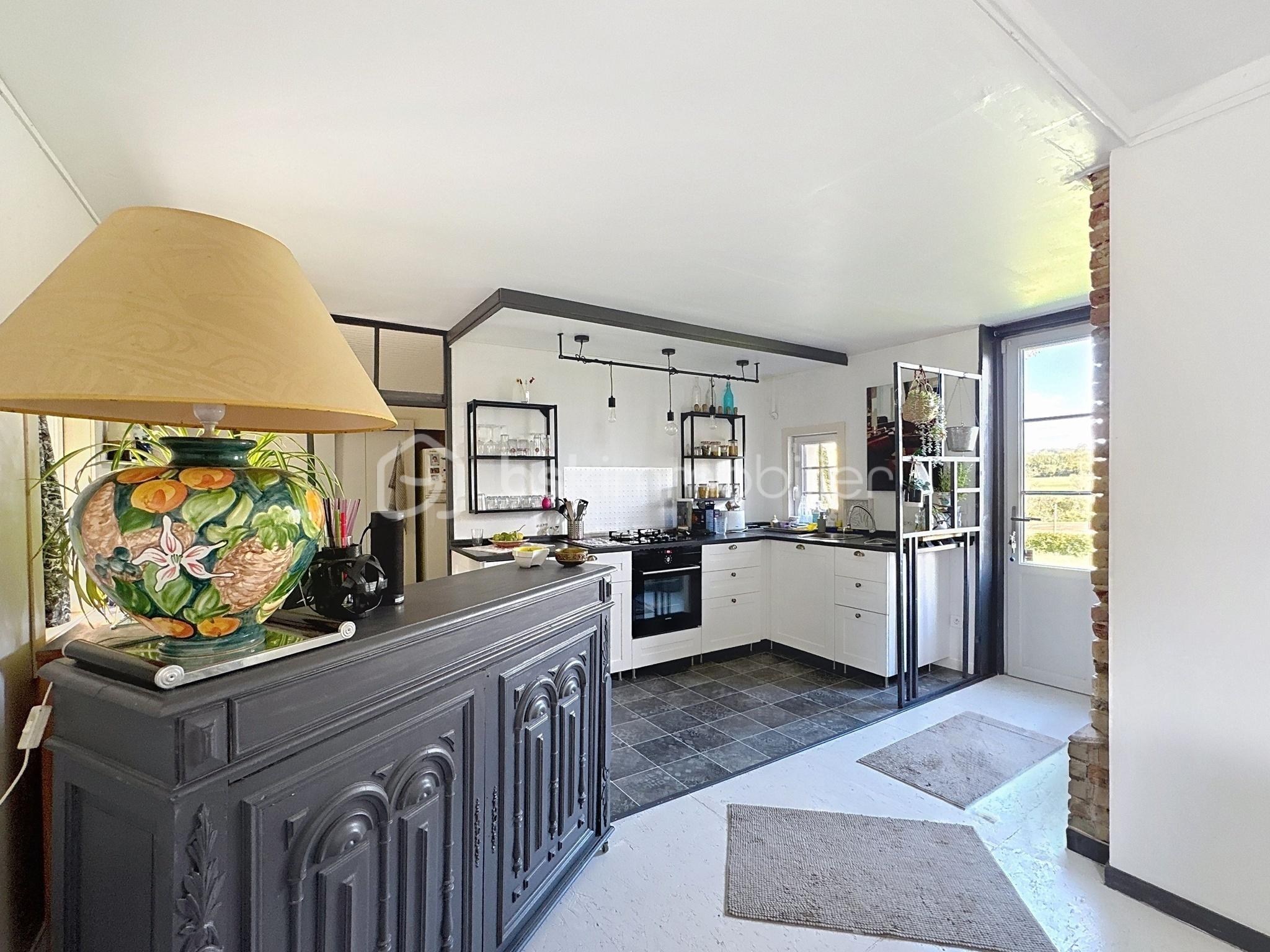 Maison de 104 m² - Séjour sur cuisine.jpg