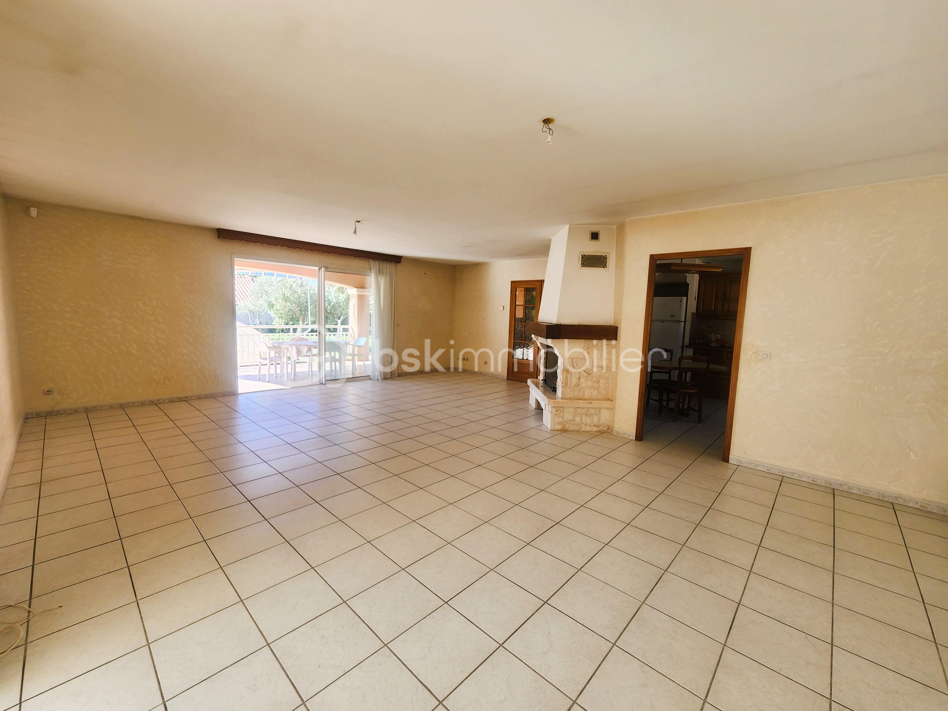 Villa de 174 m² - Séjour vue terrasse et cuisine.jpg