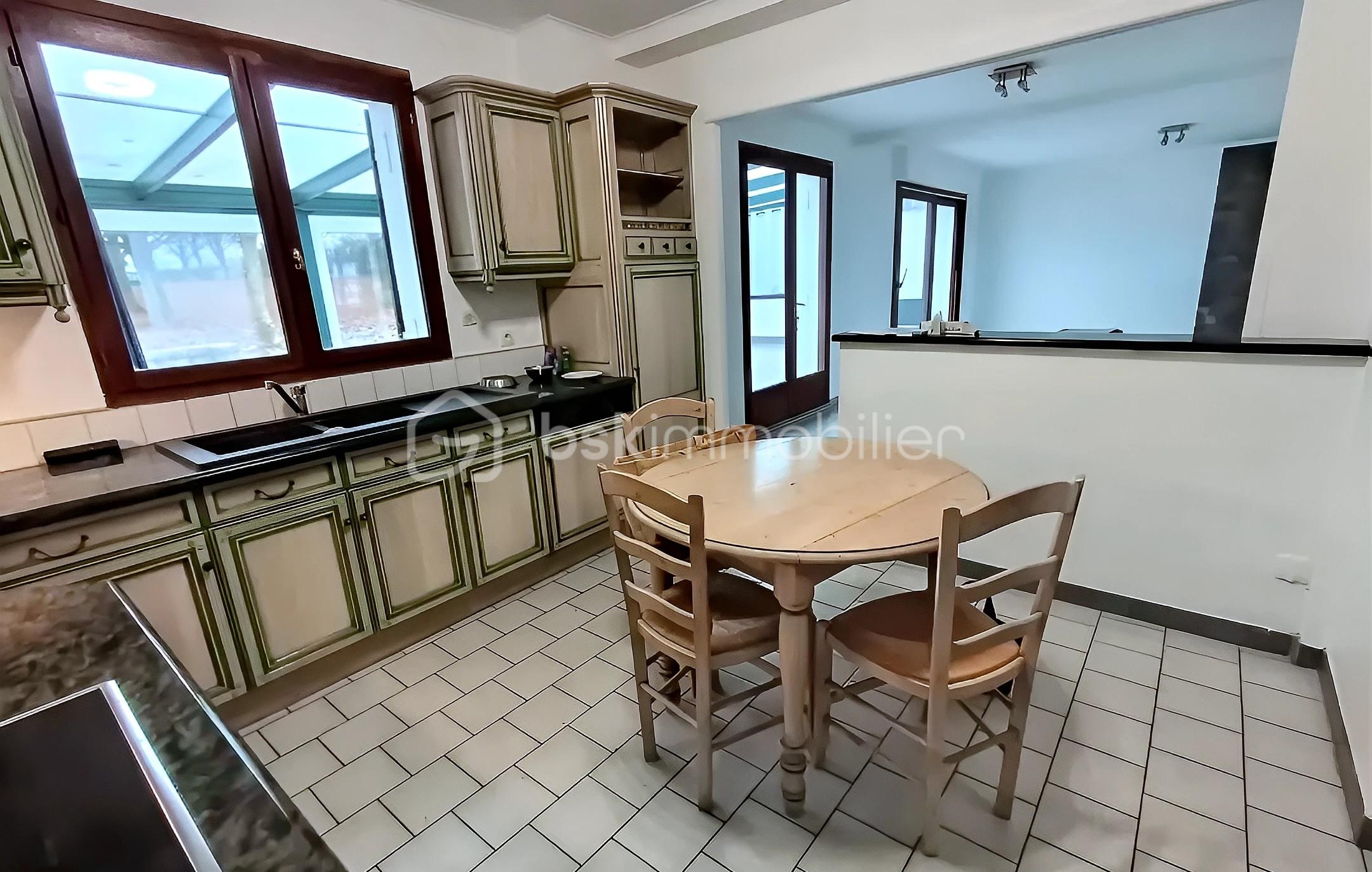 Maison traditionnelle de 122 m² - GIV PIZZONI à GOURGEOT cuis v veranda.jpg