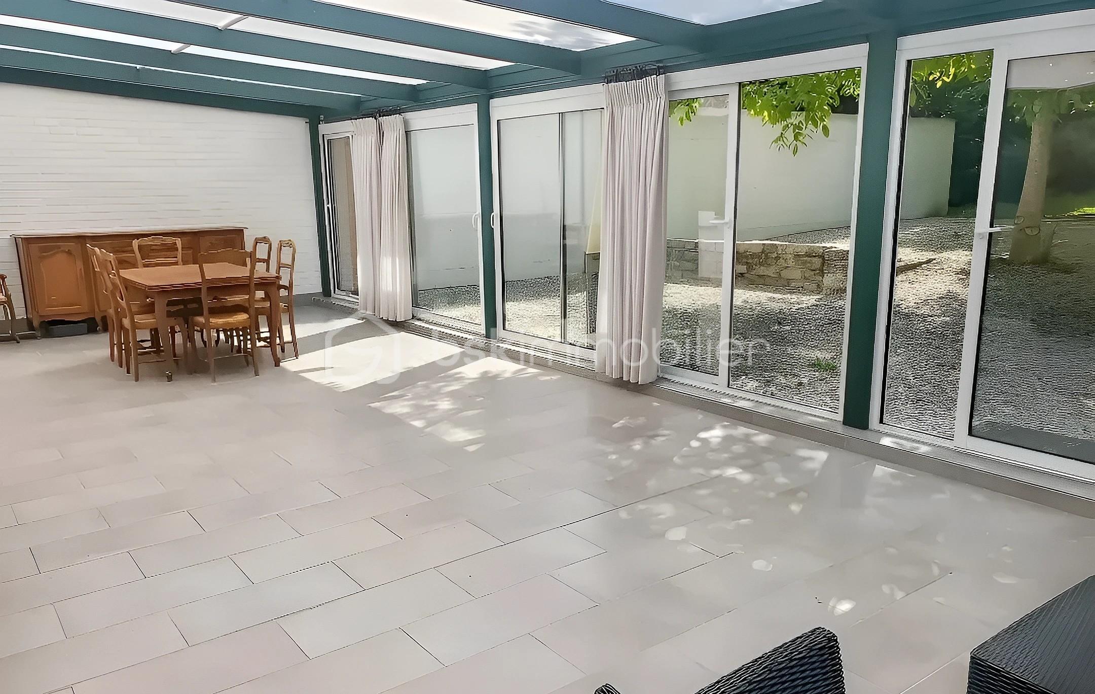 Maison traditionnelle de 122 m² - GIV THIERRY OK véranda sur terrasse.jpg