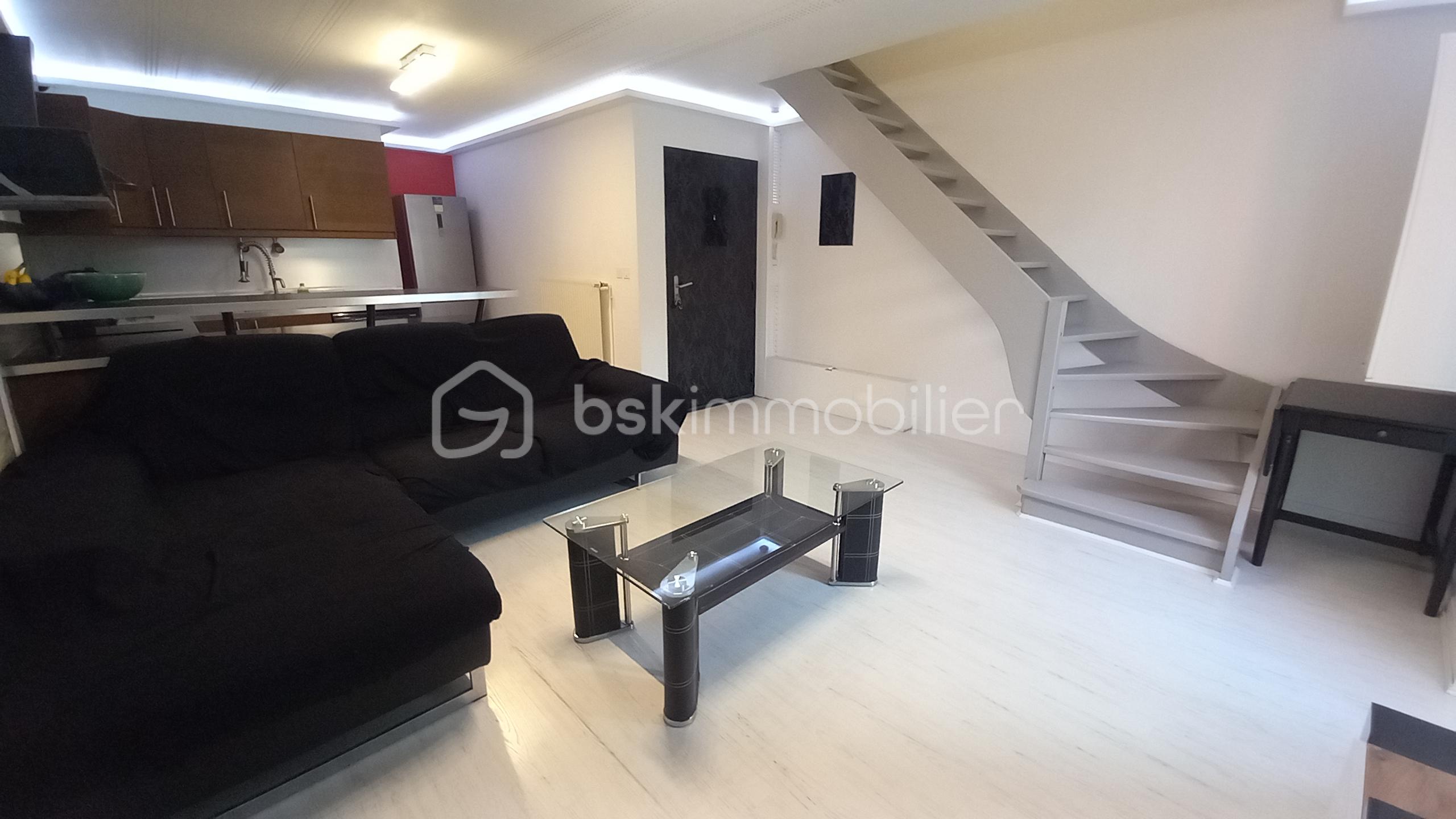 Appartement de 90 m² - Appartement La Côte St André Les Halles Photo Salon 5.jpg