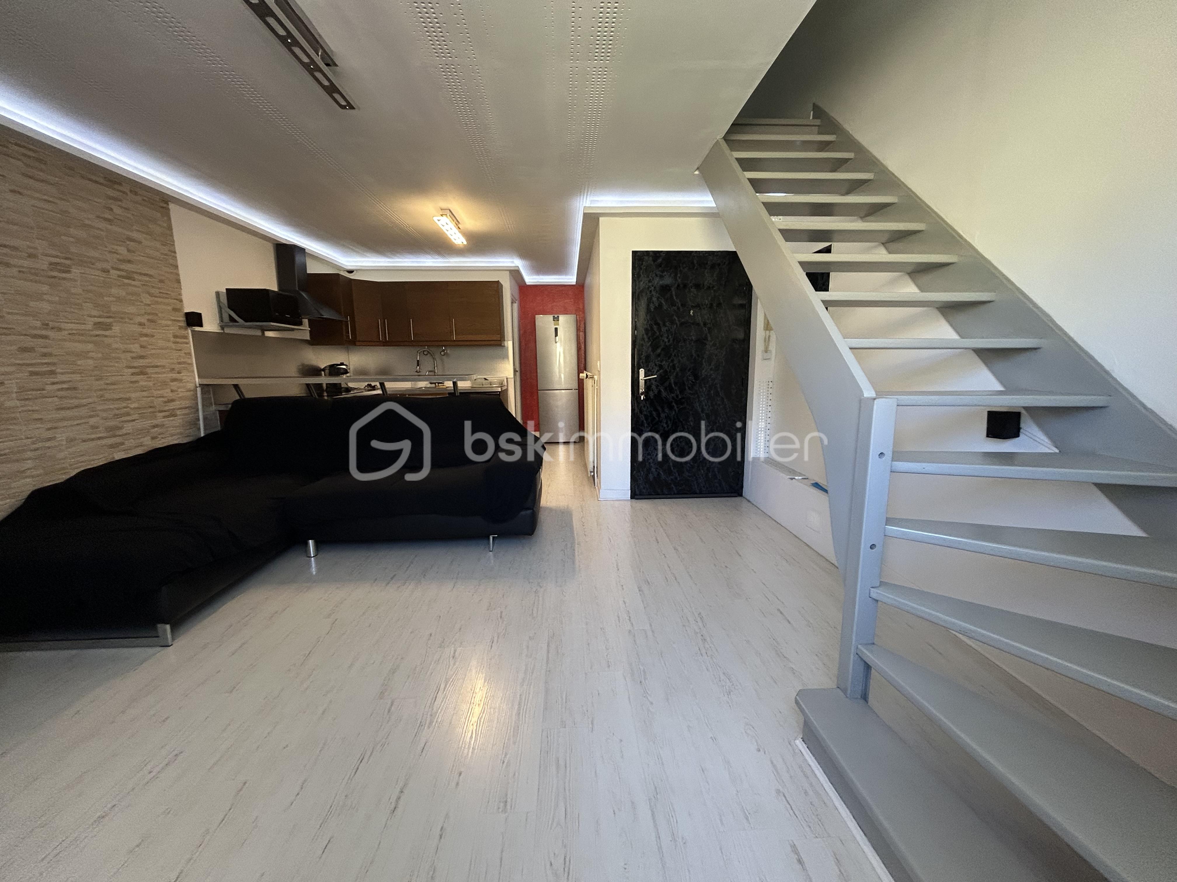 Appartement de 90 m² - Appartement La cote St Andre - Les Halles - Photo salon 13.jpg.jpeg