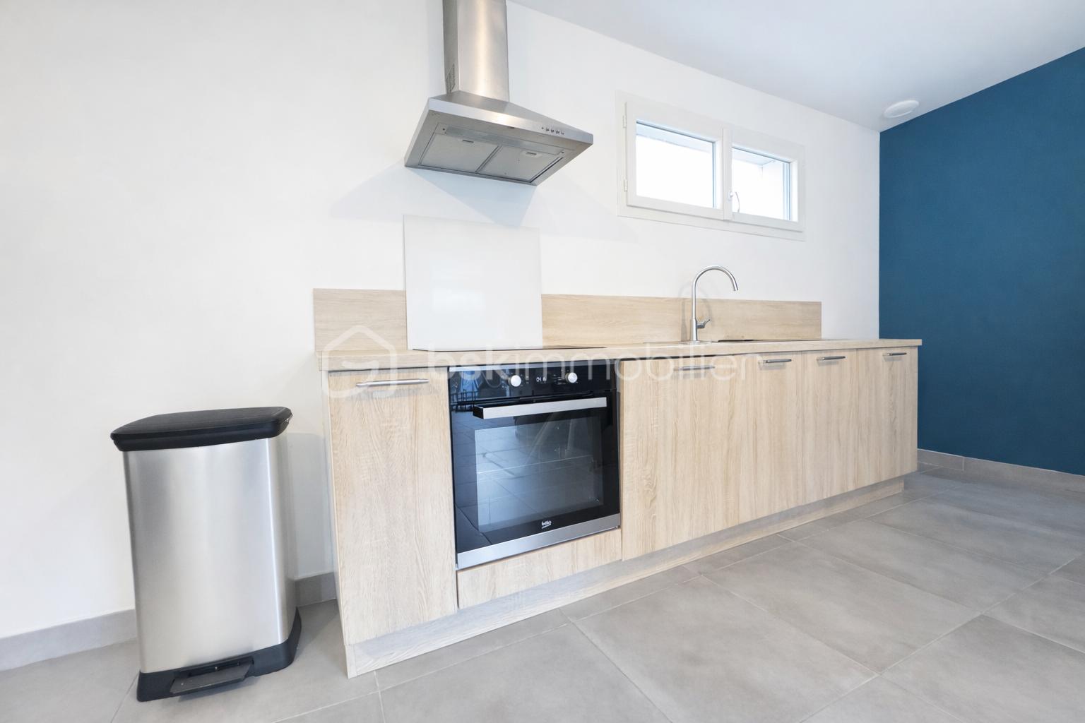 Maison de 91 m² - Cuisine moderne lumineuse et épurée.png