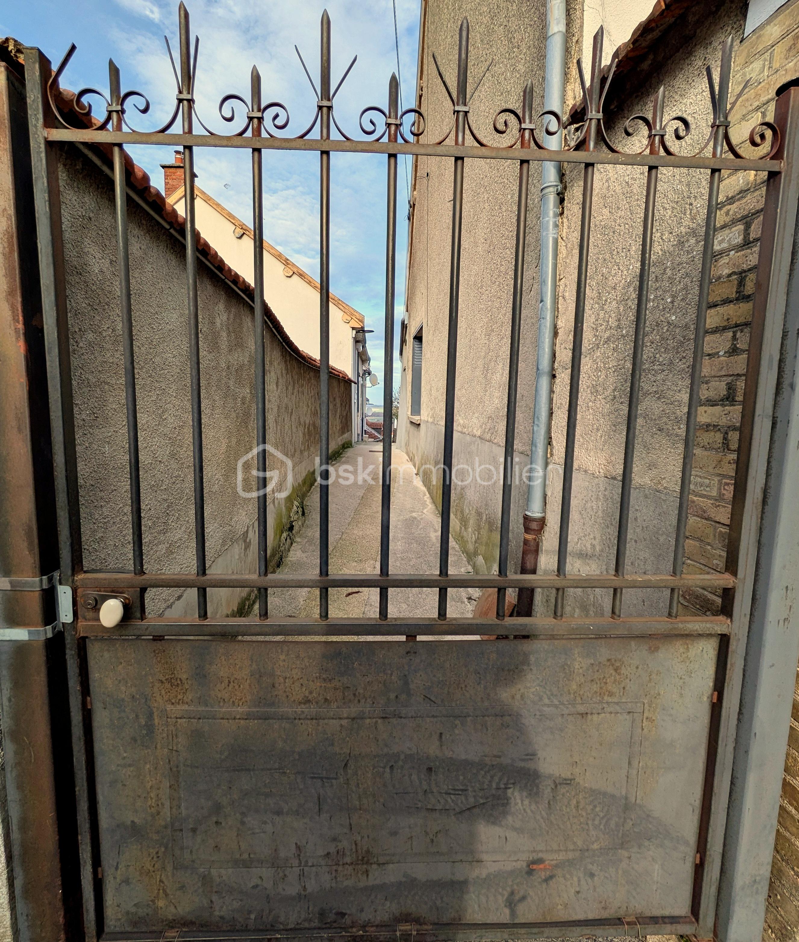 Maison de village de 60,40 m² - GRILLE.jpg