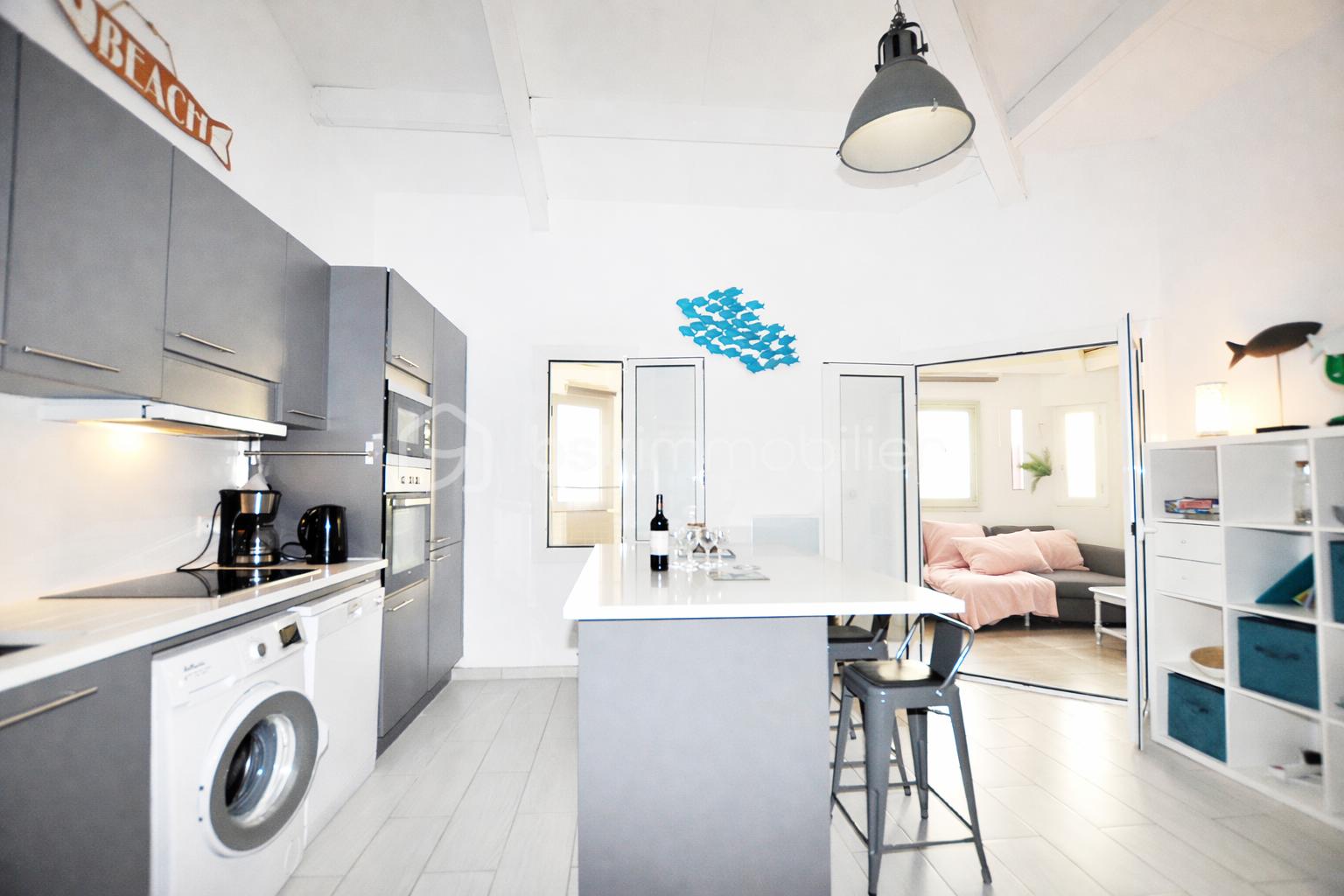 Modern kitchen with cozy living space.png