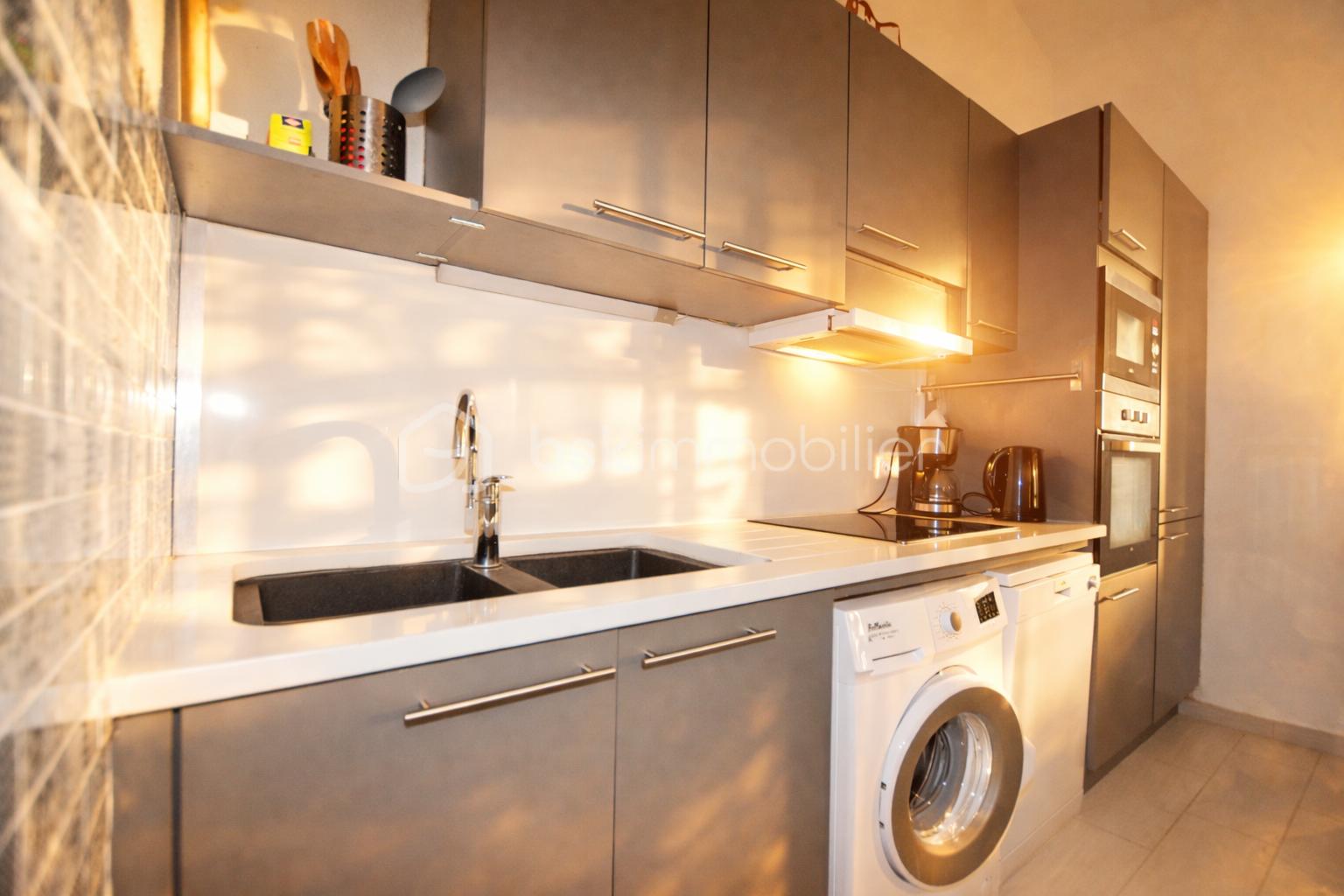 Modern kitchen with warm sunlight.png