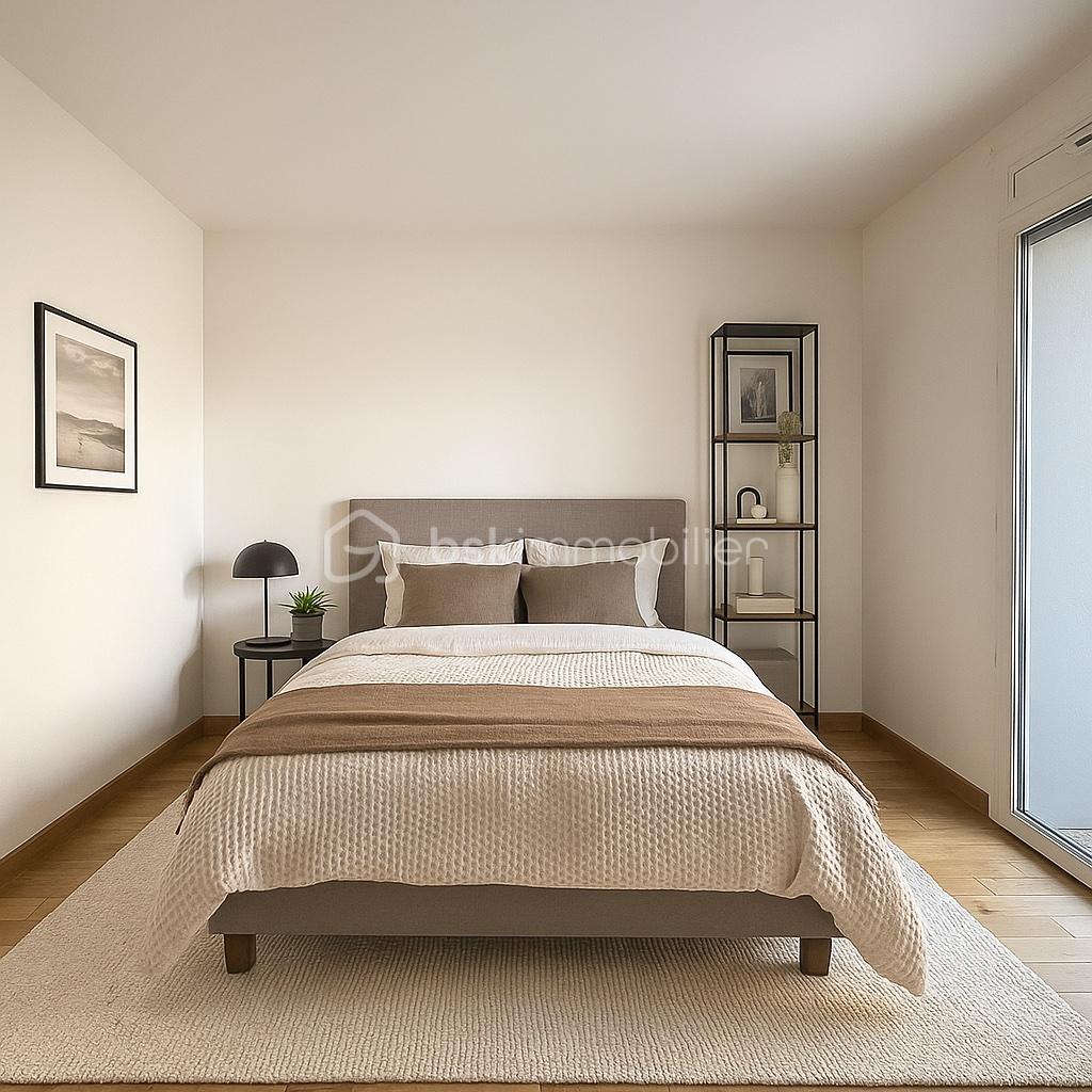 Appartement de 44,56 m² - Chambre lumineuse avec vue automnale.jpg