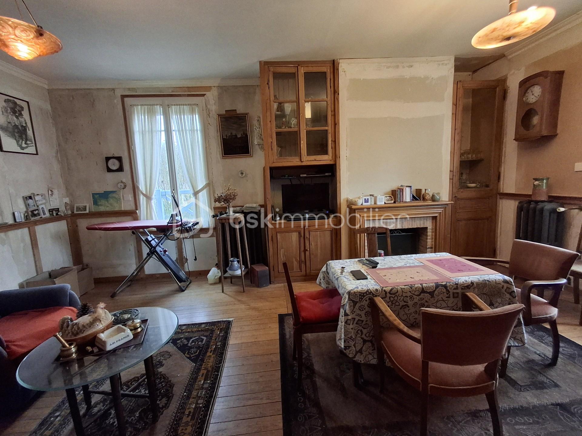 Maison de 115 m² - Pièce de vie paysage vers cheminee.jpg