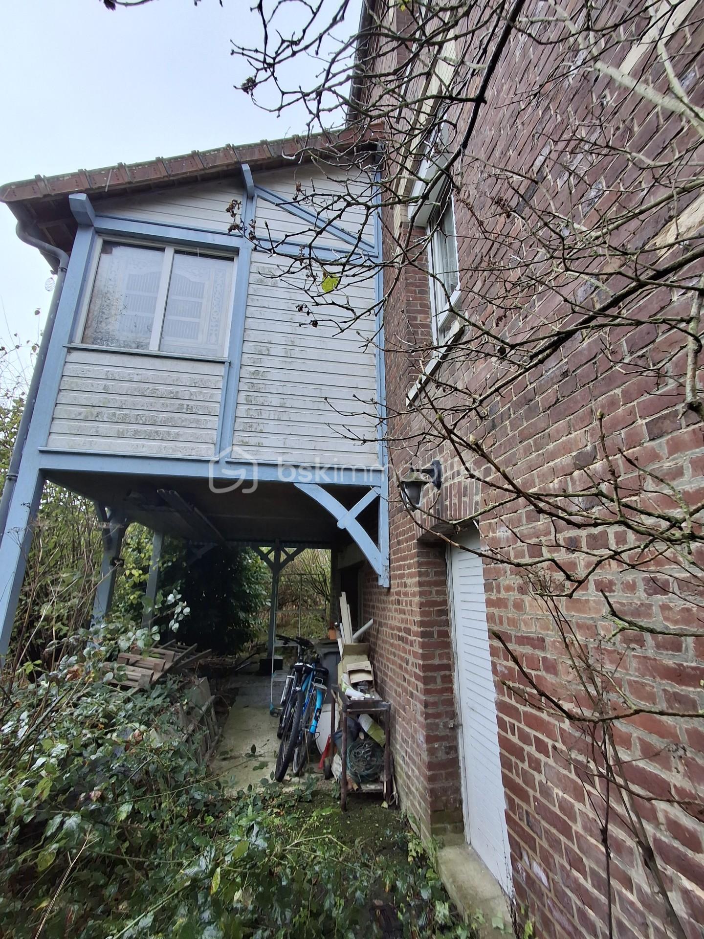 Maison de 115 m² - Façade coté jardin véranda portrait.jpg