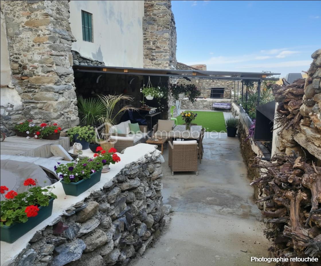 Maison de village de 90 m² - terrasse 1 aménagée logo.jpg