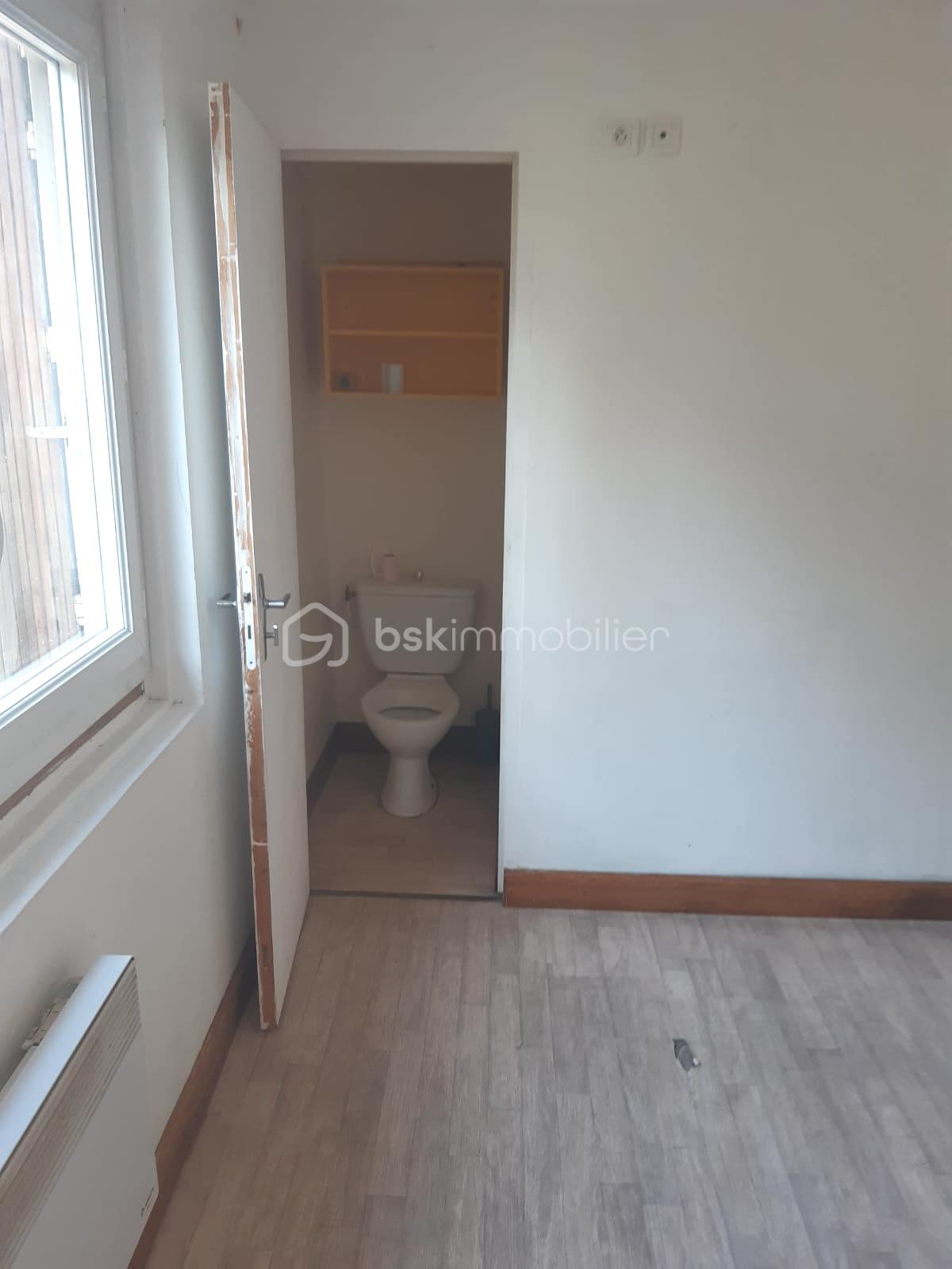 Maison de 106,99 m² - 11. RDC - salon_wc.jpeg