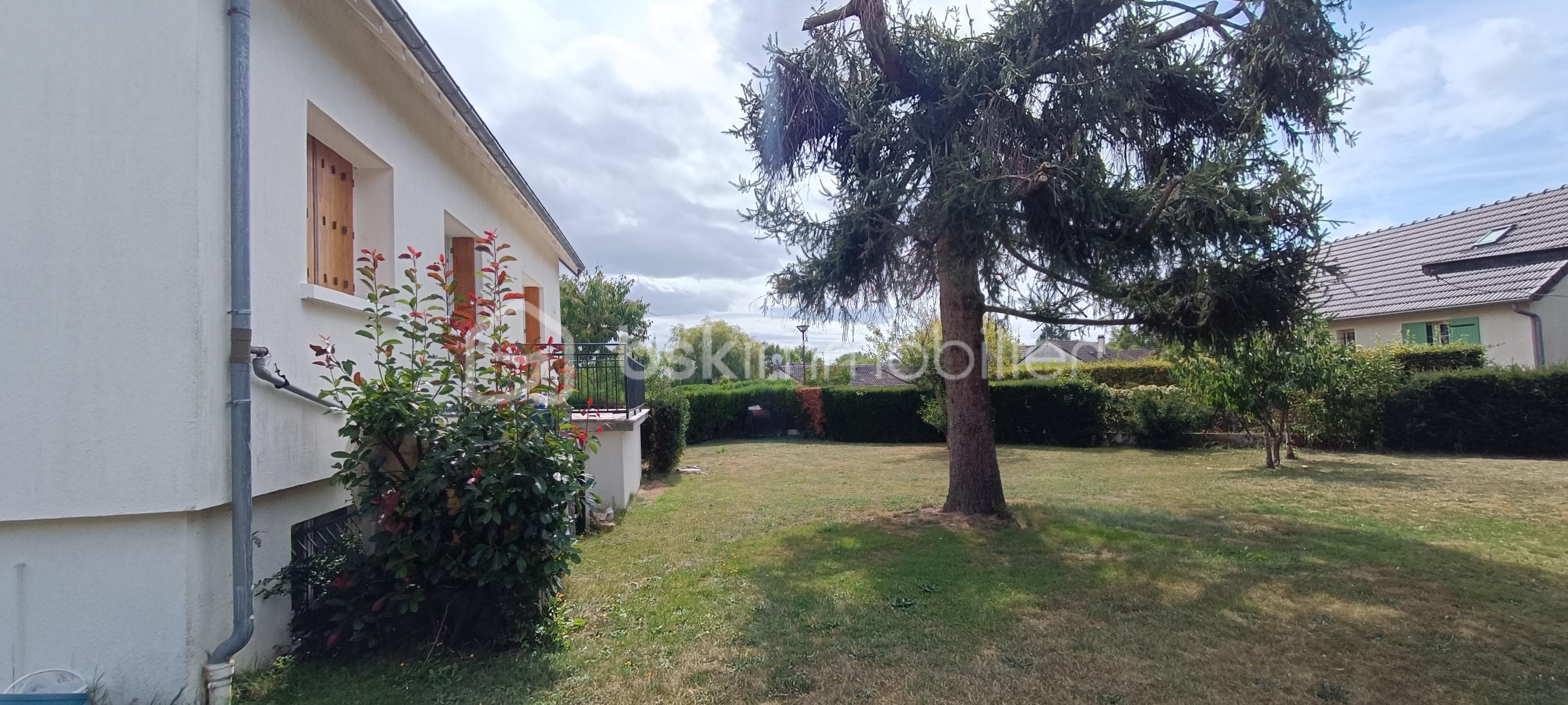Maison traditionnelle de 130 m² - Jardin arrière.jpg