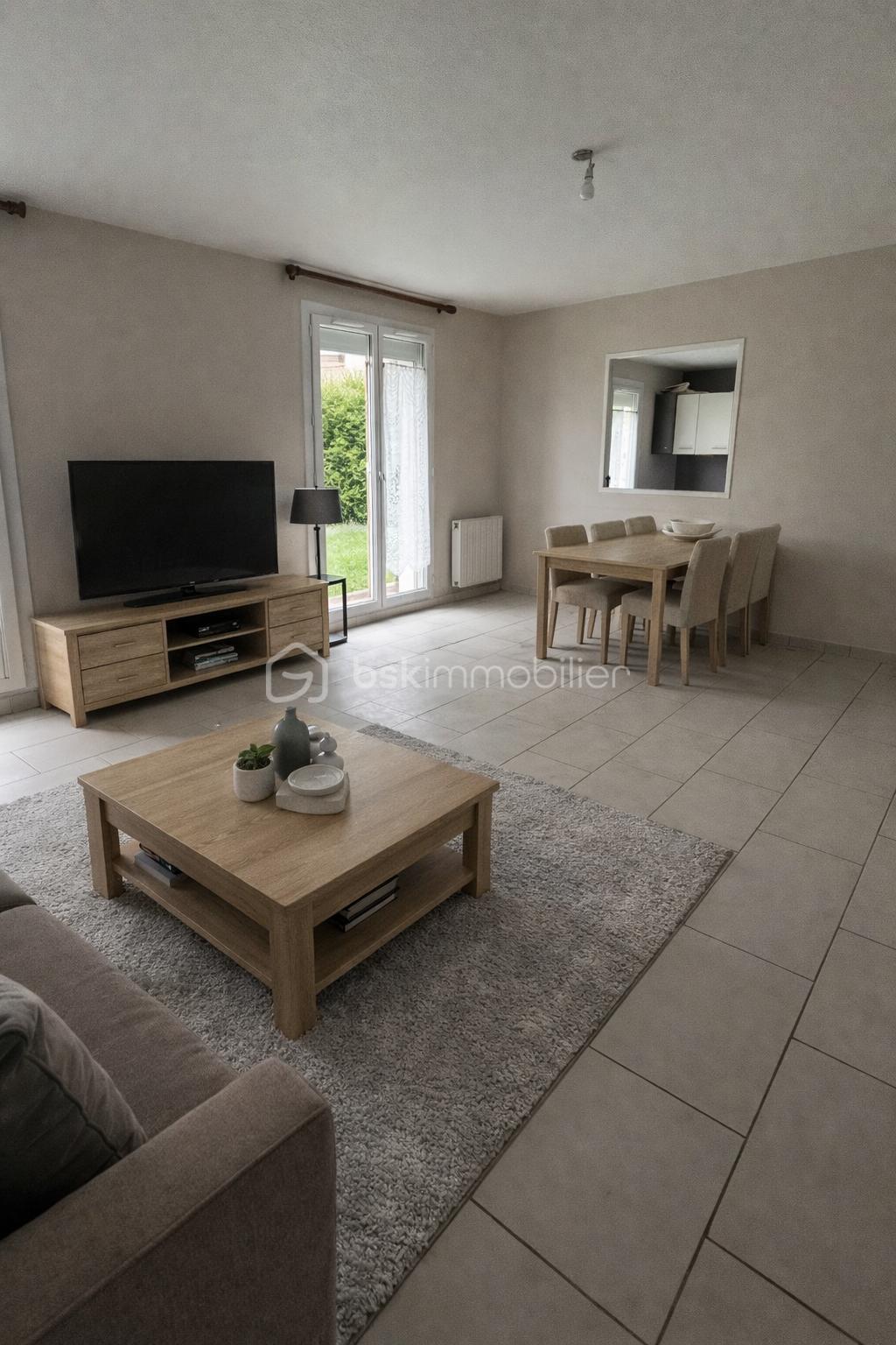 Salon moderne avec meubles en bois clair.png