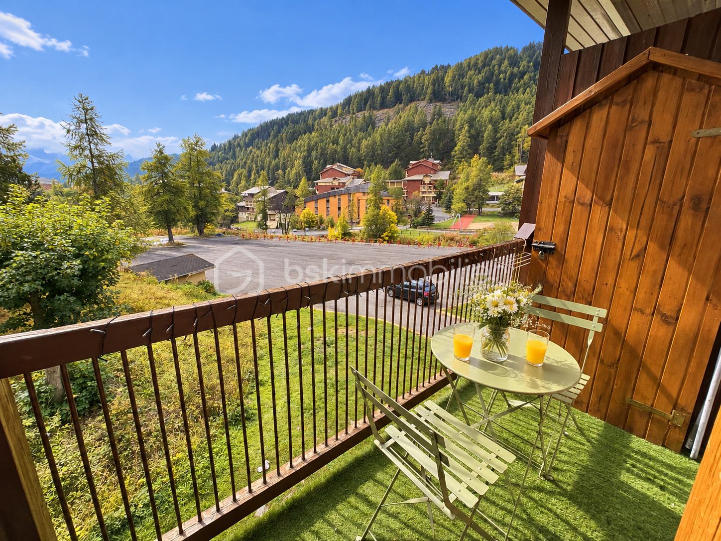 Balcon fleuri avec vue alpine (1).png