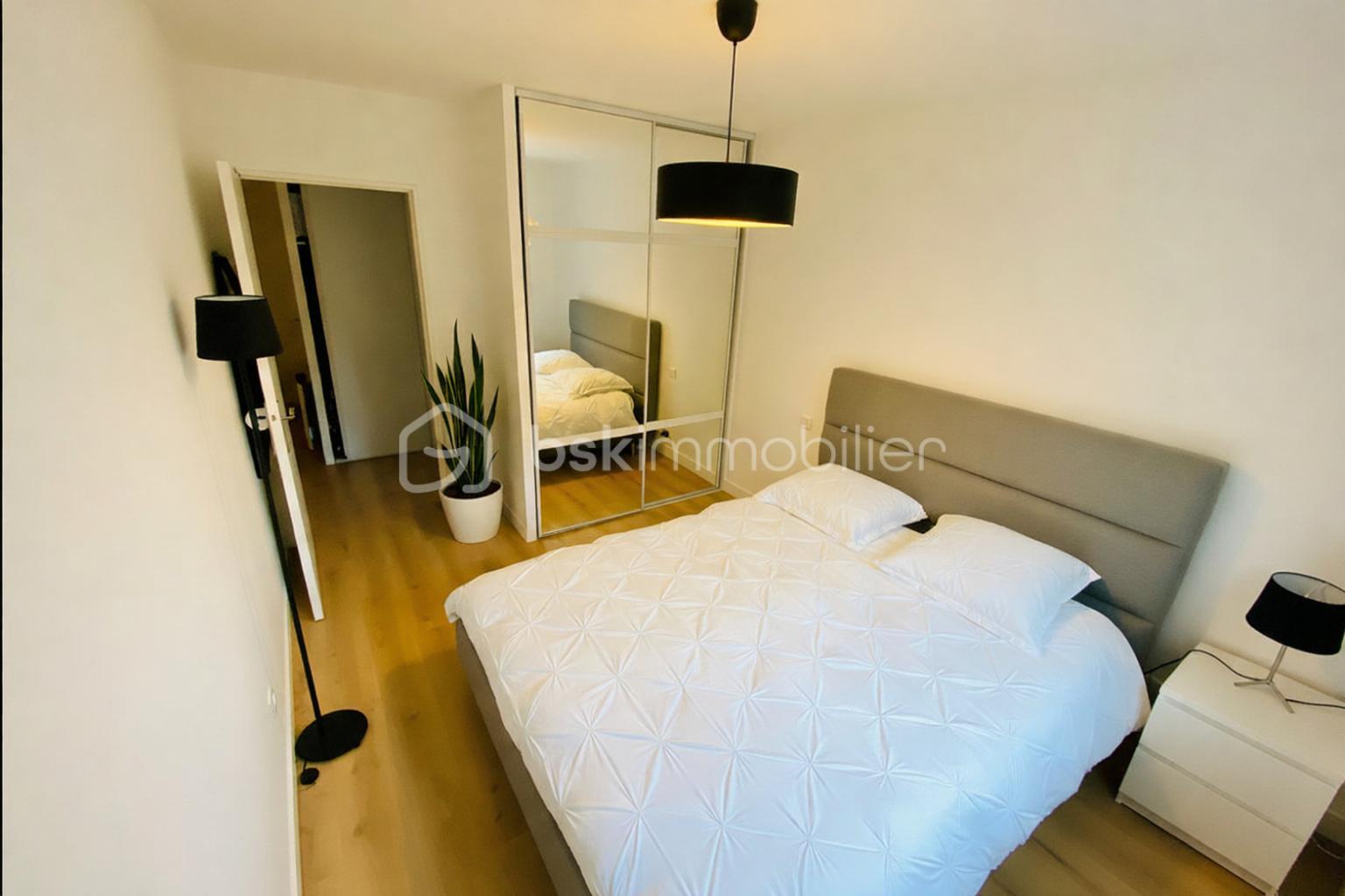 Appartement de 65,09 m² - Chambre minimale et lumineuse.png