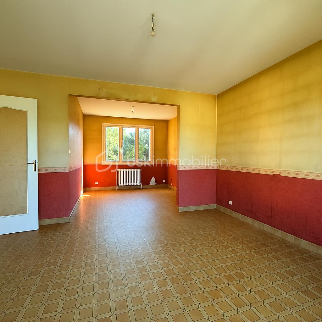 Maison en pierre de 111 m² - salon séjour.png